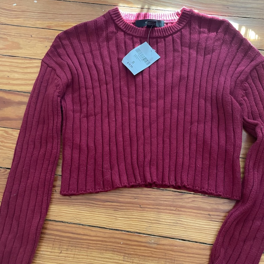 Maroon sweater with tags on